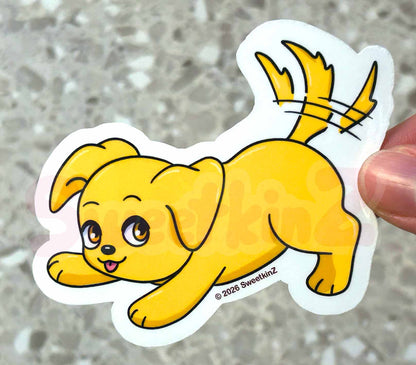Cartoon dog sticker held by a hand on a textured surface
